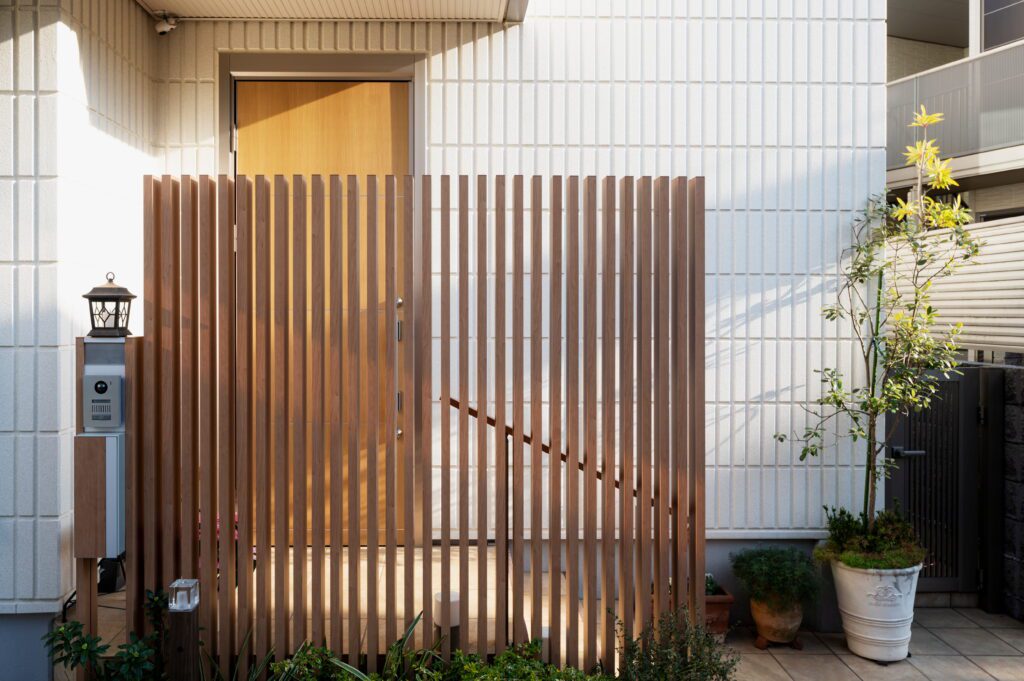 House Entrance Japanese Building With Fence - Griffin Fence Houston TX