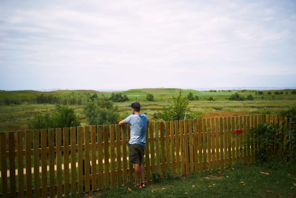 Griffin Fence Houston TX - Young Tourist Looking Green Landscape Standing Fence
